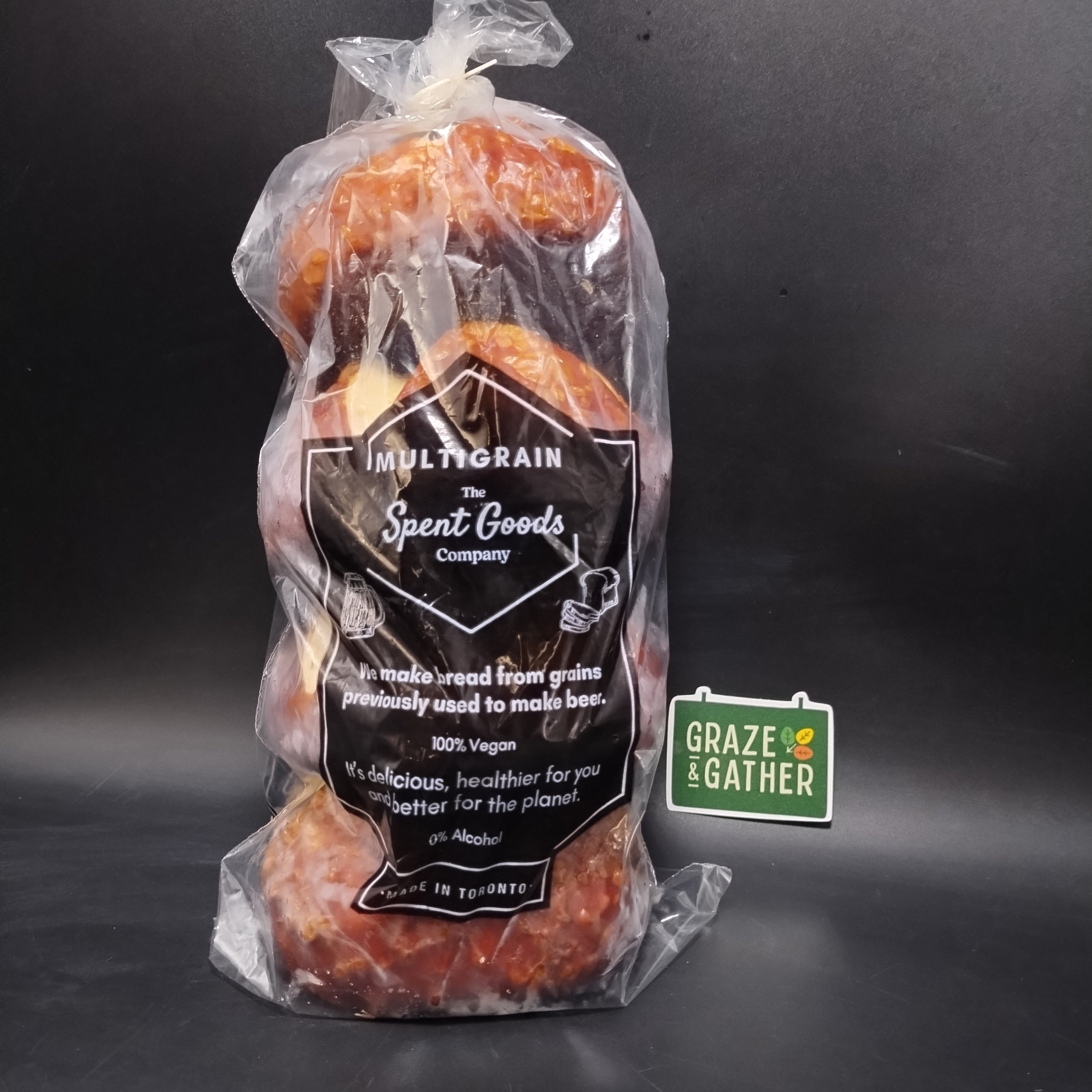 Packaged pretzel buns with a label on a dark background