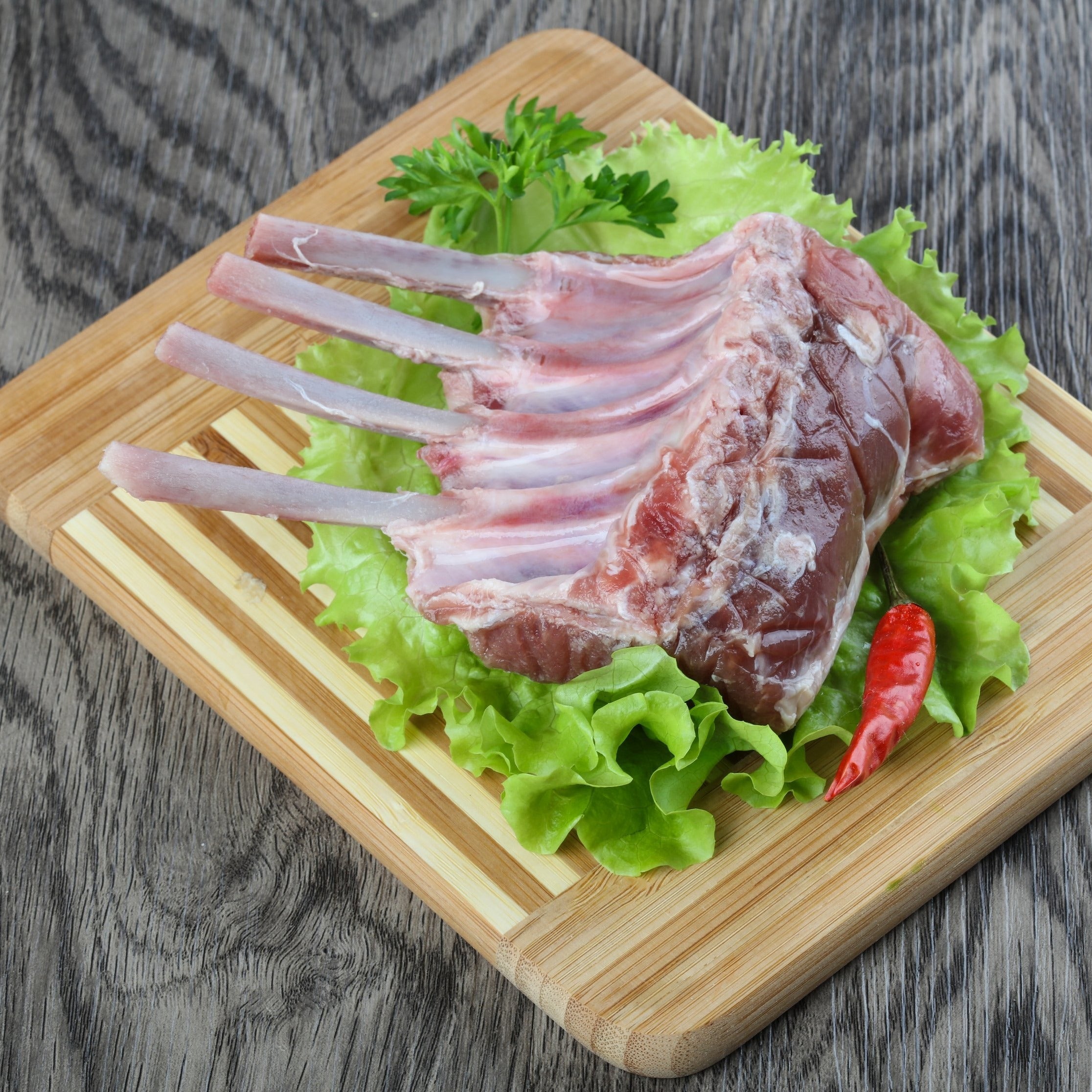 Rack of lamb on cutting board