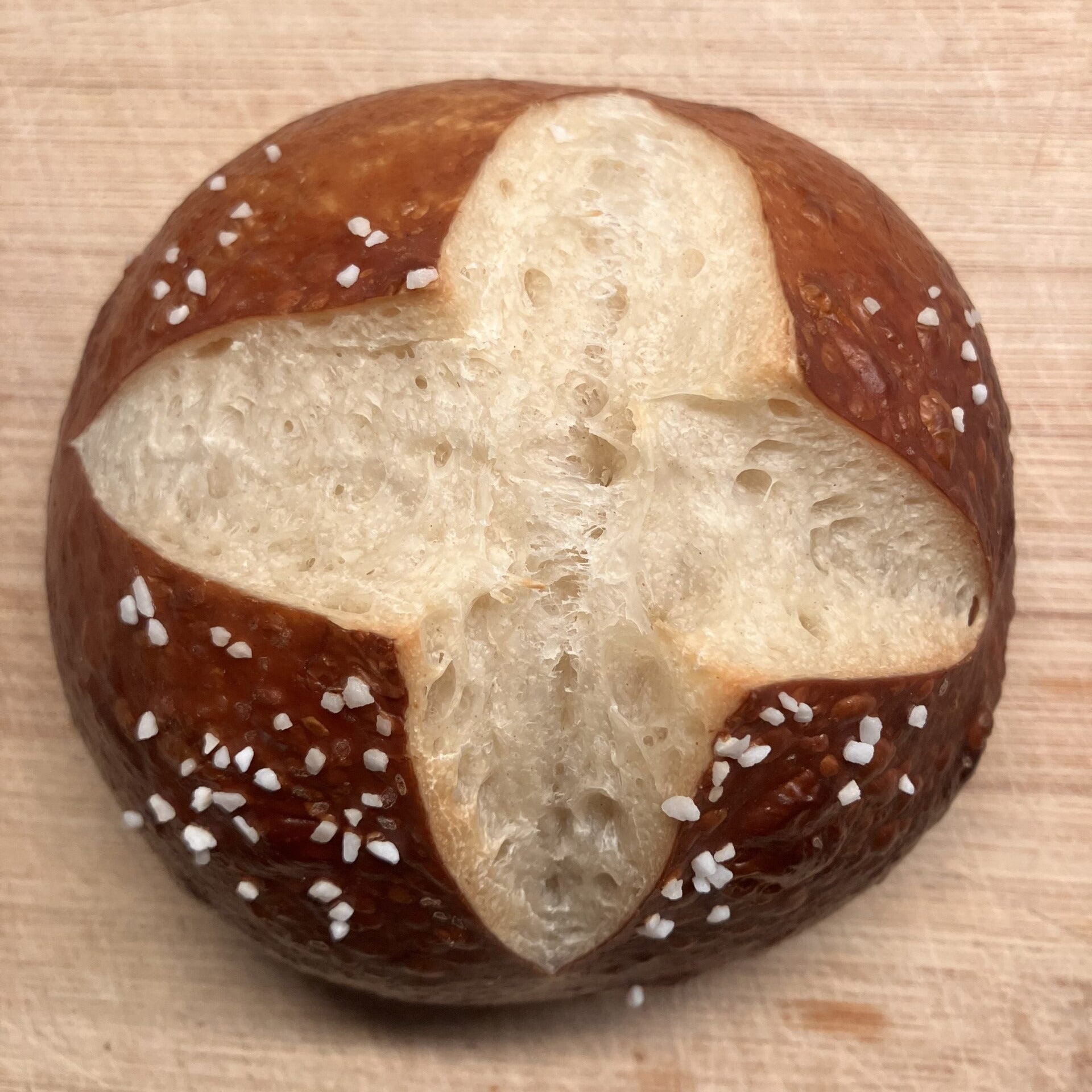 pretzel bread on a wooden surface