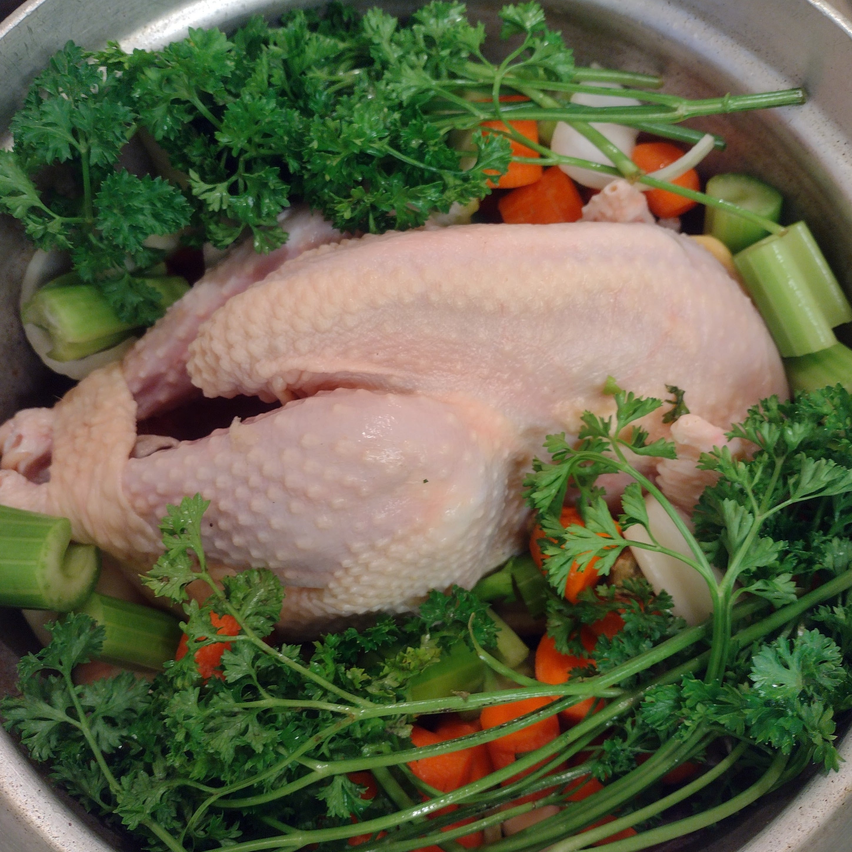 spent hen in a pot with vegetables