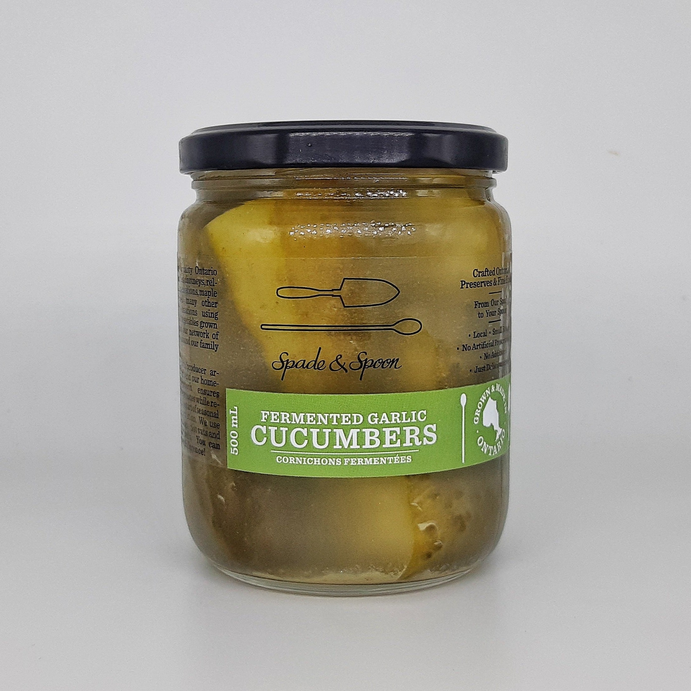 Jar of fermented garlic cucumbers.