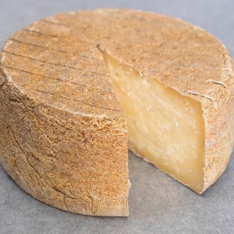 A wheel of Toscano cheese from Monforte Dairy.