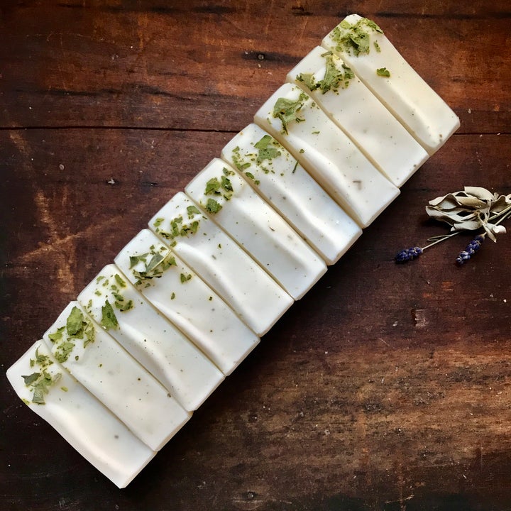 ten bars of lavender and white sage soap lined up, viewed from above.