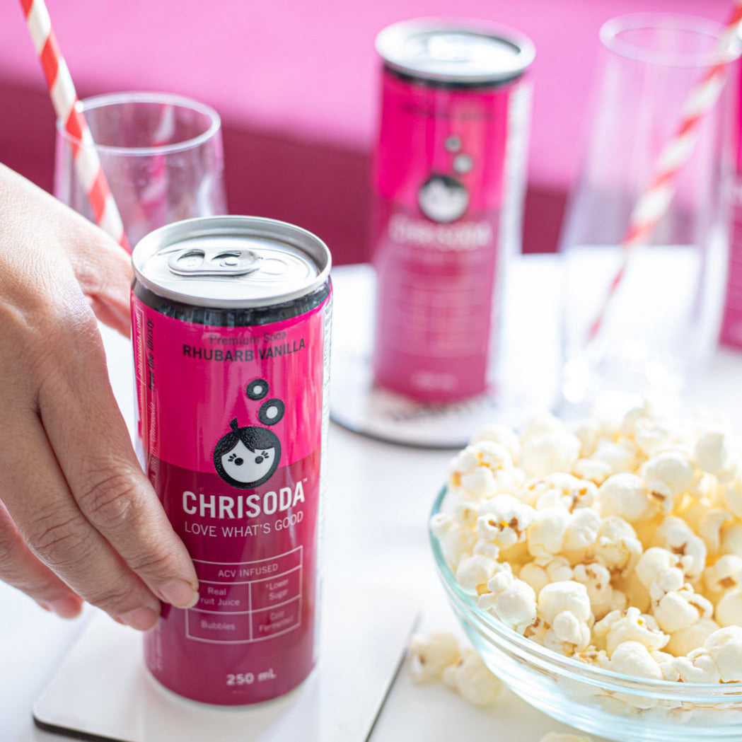 cans of soda with popcorn